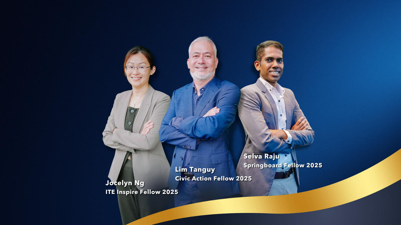 A man sitting at his desk feeling energised and inspired.